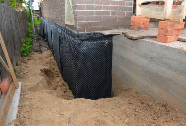 Happy homeowners after waterproofing job in Morrison